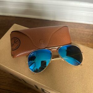 Blue polarized Ray-Ban aviator glasses. Excellent condition. Gold frames.